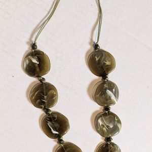 Green with White Swirls Flat Stone-Like Ne…